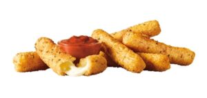 5 Sonic mozzarella sticks with a cup of marinara sauce on a white background. One mozzarella stick has been pulled in half.
