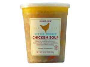 An image of a Trader Joe's kettle cooked chicken soup on a white background.