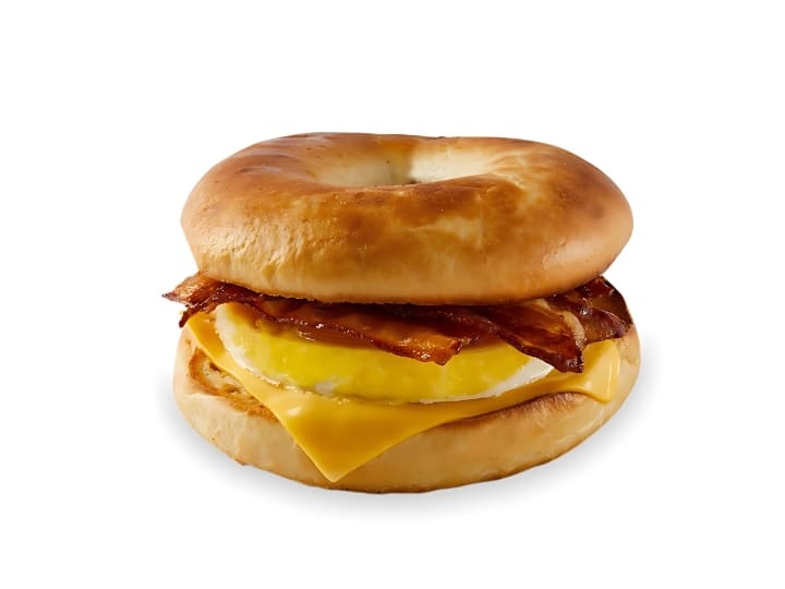 An image of a Tim Hortons bacon bagel breakfast sandwich on a white background.