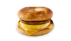 An image of a Tim Hortons sausage bagel breakfast sandwich on a white background.