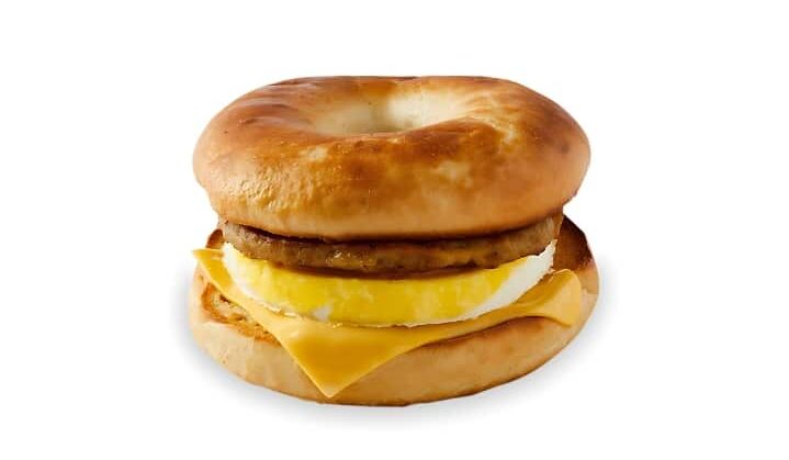An image of a Tim Hortons sausage bagel breakfast sandwich on a white background.