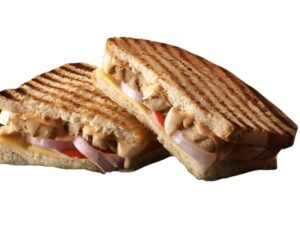 An image of a Tim Hortons tuscan grilled chicken panini on a white background.