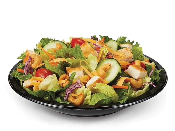 An image of a Culver's Chicken Cashew Salad with Grilled Chicken on a white background.