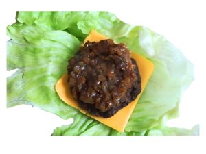 An image of an In N Out protein style hamburger with onion on a white background.