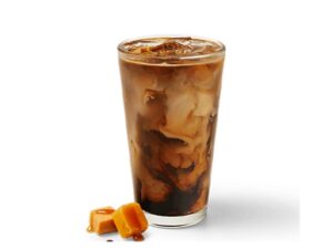 An image of a caramel iced coffee from Krispy Kreme in a glass on a white background.