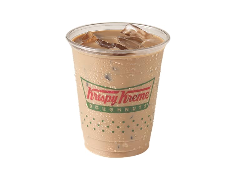An image of an iced latte from Krispy Kreme in a plastic cup on a white background.