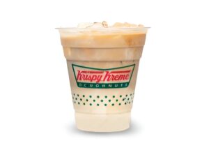 An image of an iced vanilla latte from Krispy Kreme in a plastic cup on a white background.