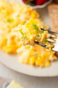 A closer look at cottage cheese omelet on a fork.