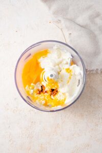 Cottage cheese, eggs, agave syrup, and vanilla extract in a food processor.