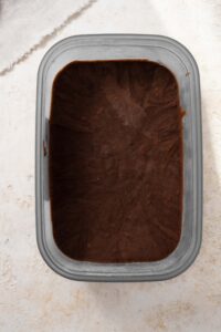 A top view of a tub of chocolate cottage cheese ice cream