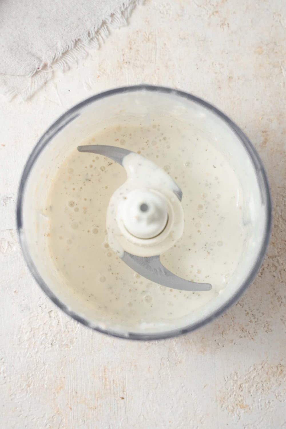 Cottage cheese ranch dip blended in a food processor.