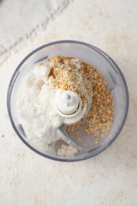 Cottage cheese and ranch seasoning in a food processor.
