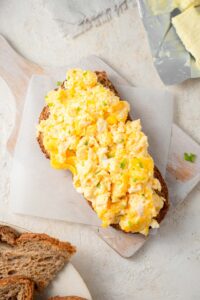 Cottage cheese omelet on a slice of toasted bread.