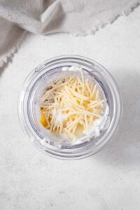 Healthy Caesar dressing ingredients in a blender.