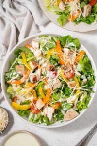 Top view of healthy chicken Caesar salad.