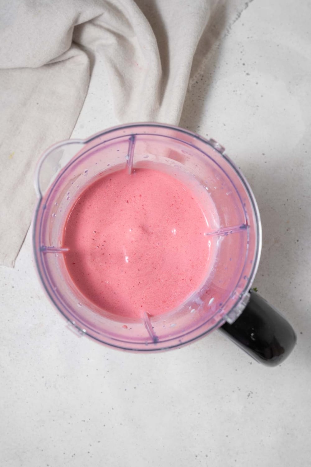 Strawberry cottage cheese in a blender.