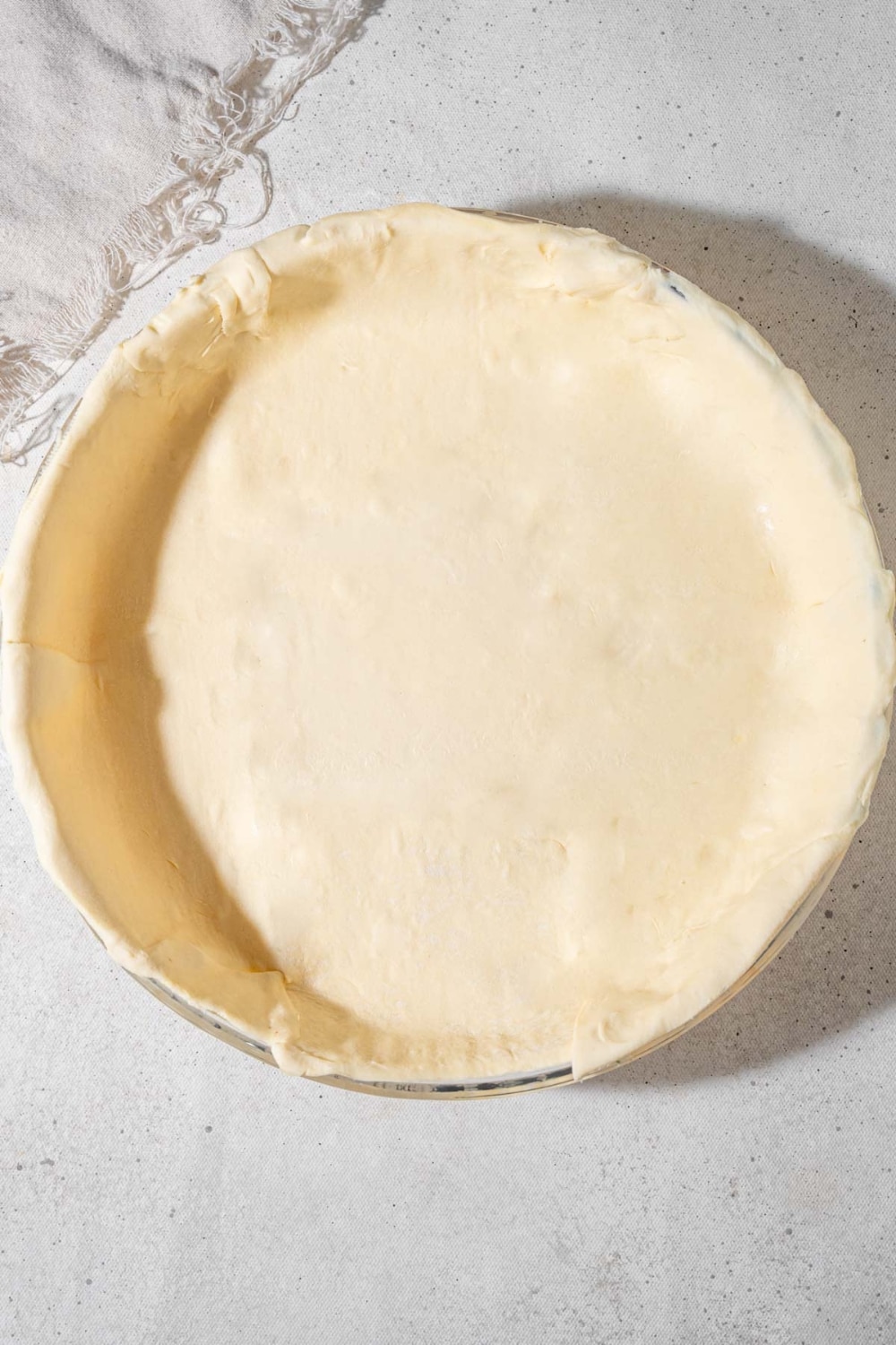 An uncooked puff pastry sheet pie crust.