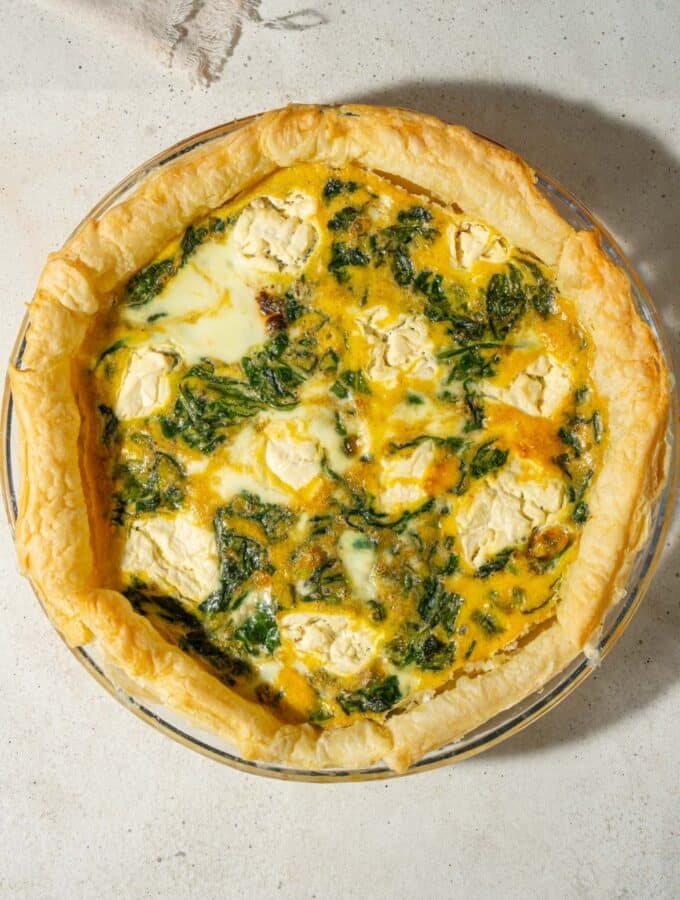 A spinach quiche with whipped cottage cheese topping.
