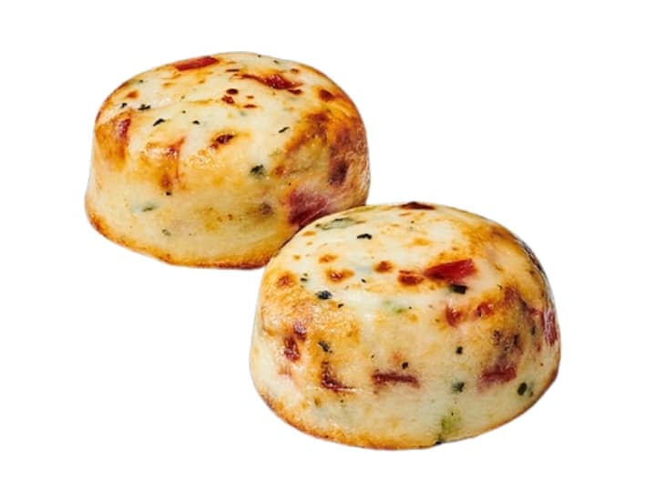A pair of Starbucks egg white and roasted red pepper egg bites.